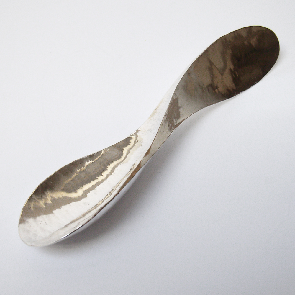 forged silver spoon